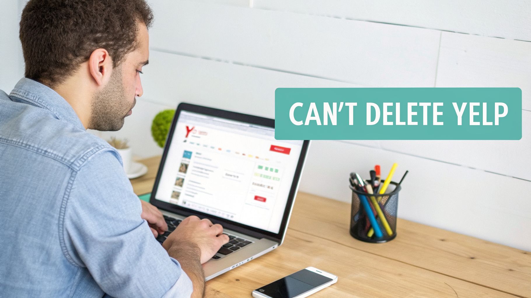 A man intently looking at a laptop screen displaying the Yelp website, with a text overlay "Can't Delete Yelp".